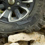 Off-road tire with a GlueTread patch on a rocky terrain